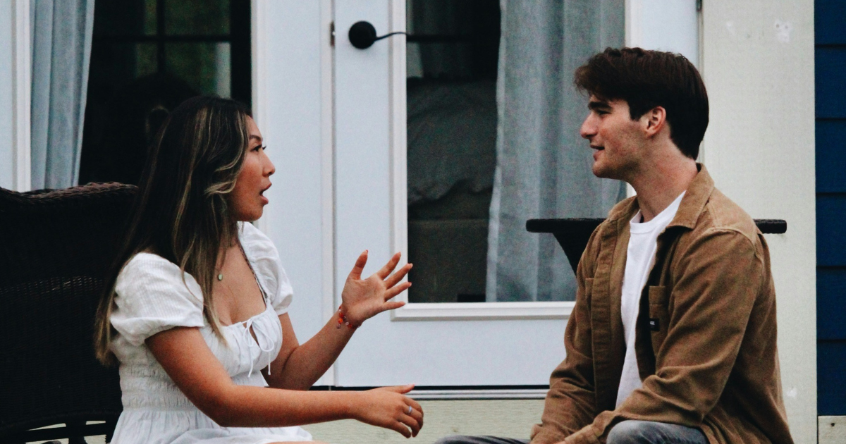 two people talking and asking questions after a missions trip