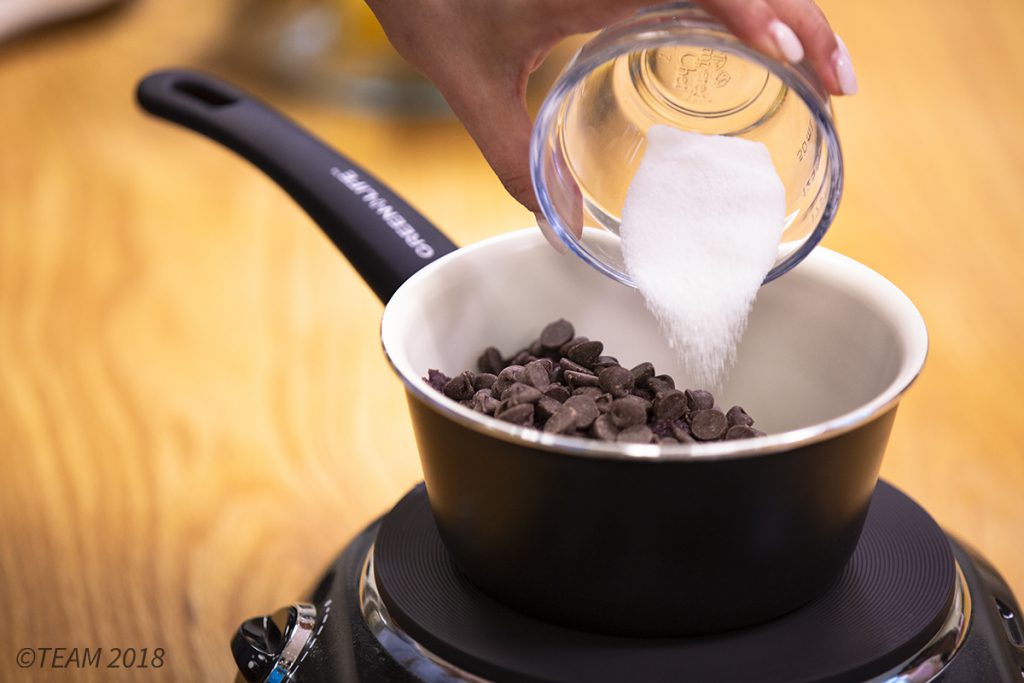 Add sugar and chocolate to the black beans.