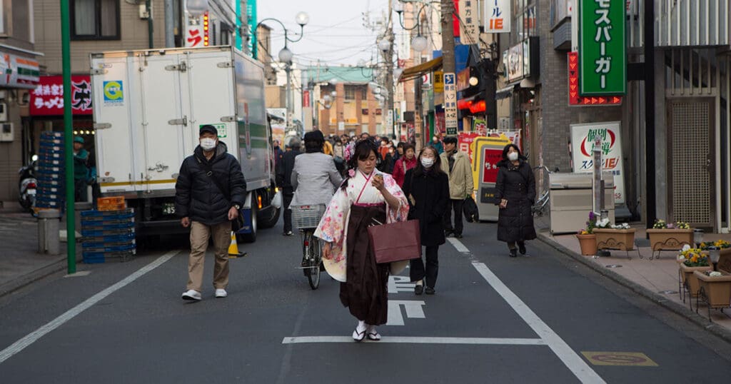 woman walking down the street in Japan in traditional clothing