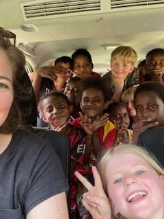 selfie of Noelle and children in papua