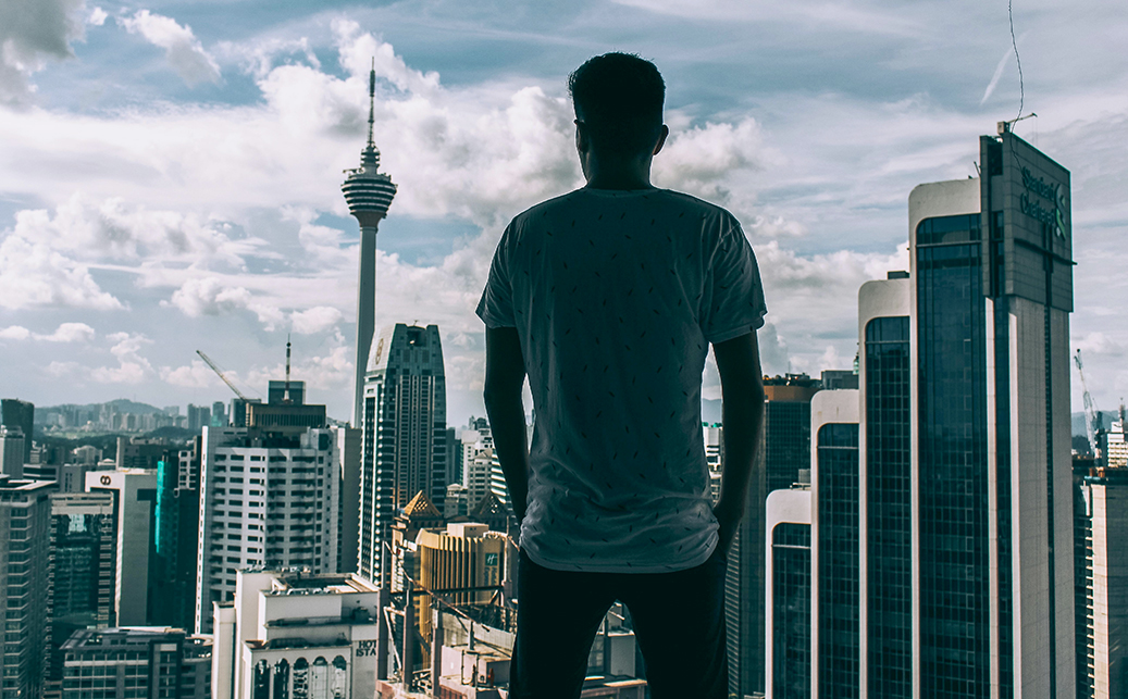 Man overlooking the city.