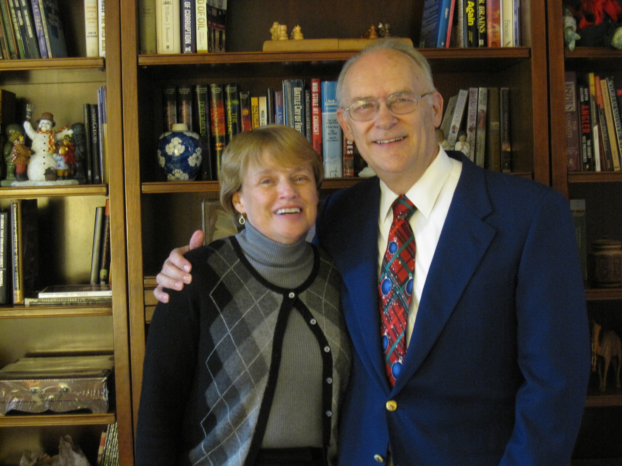 Jim and Nancy standing in their den.