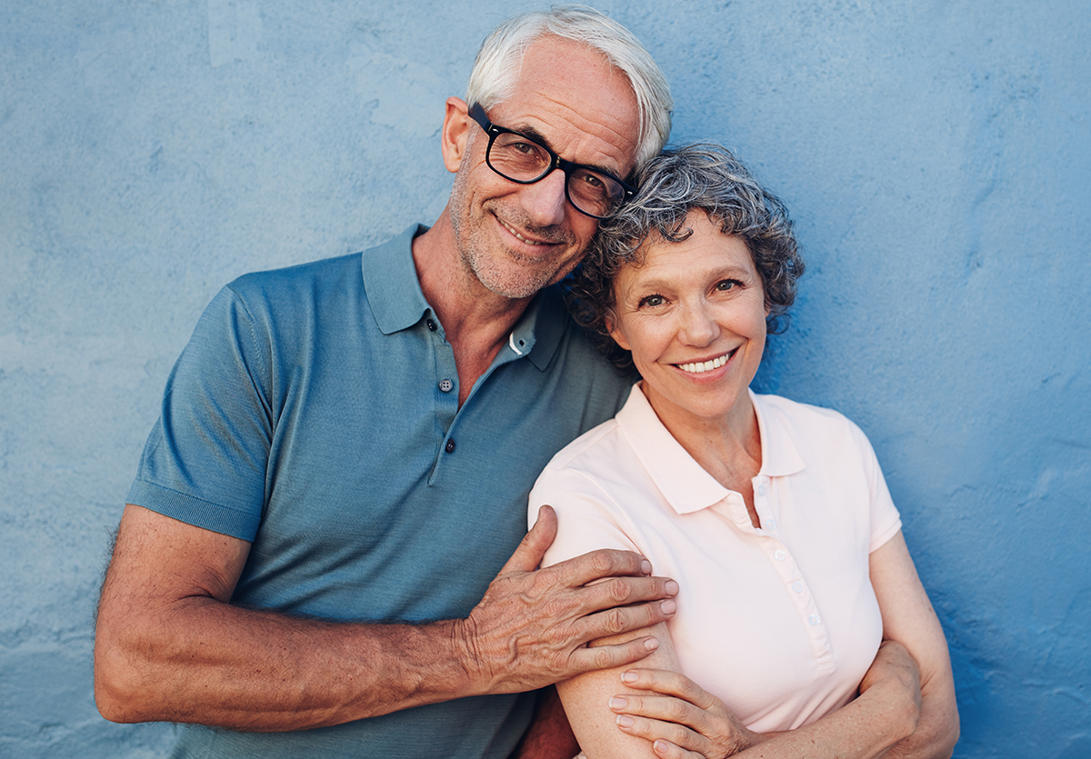 Smiling mature couple standing together