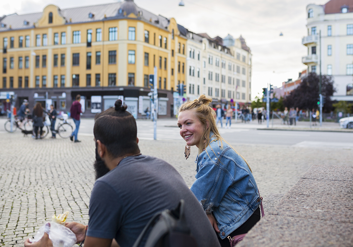 A man and woman sitting and talking.