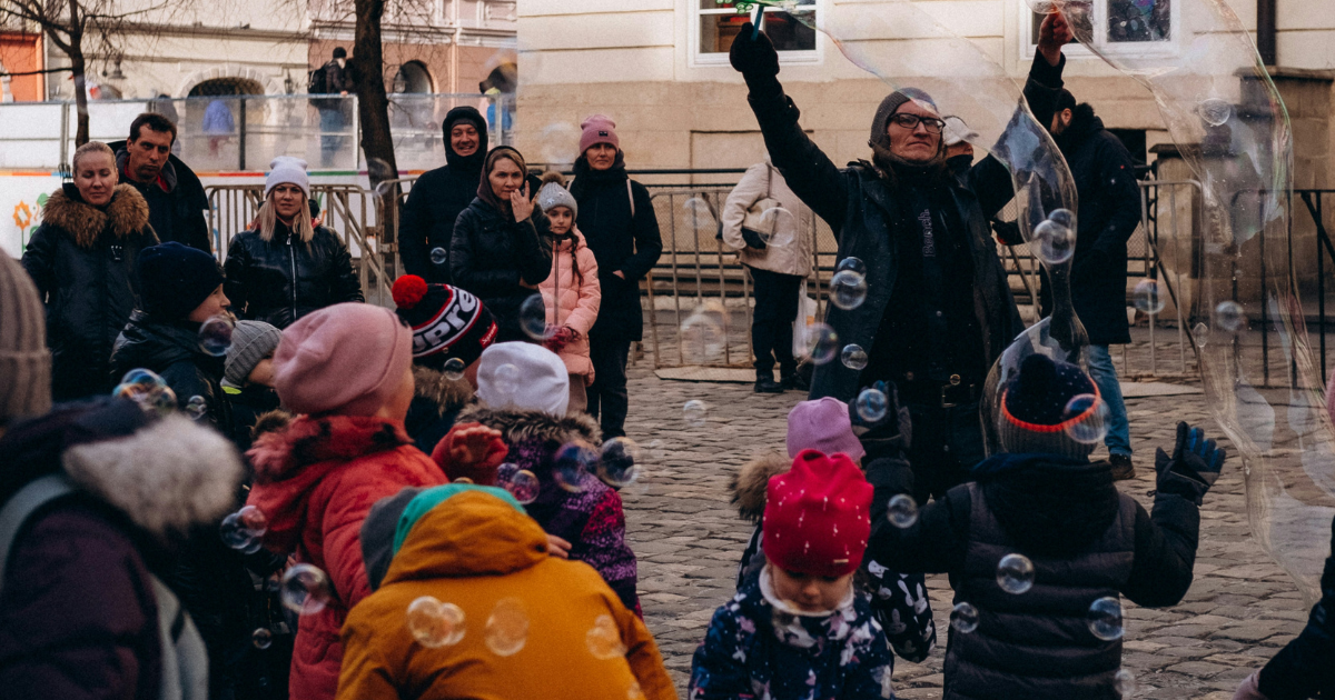 group of children playing with bubbles in Ukraine