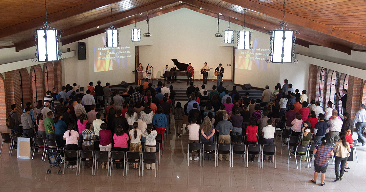 group of believers worshipping together at an international church