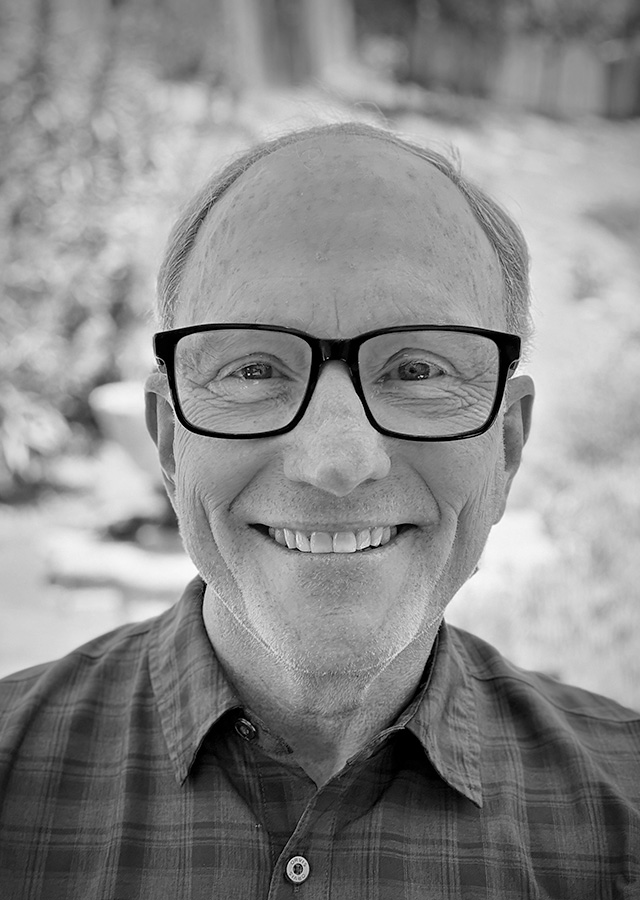 black and white portrait of Dave Hall smiling
