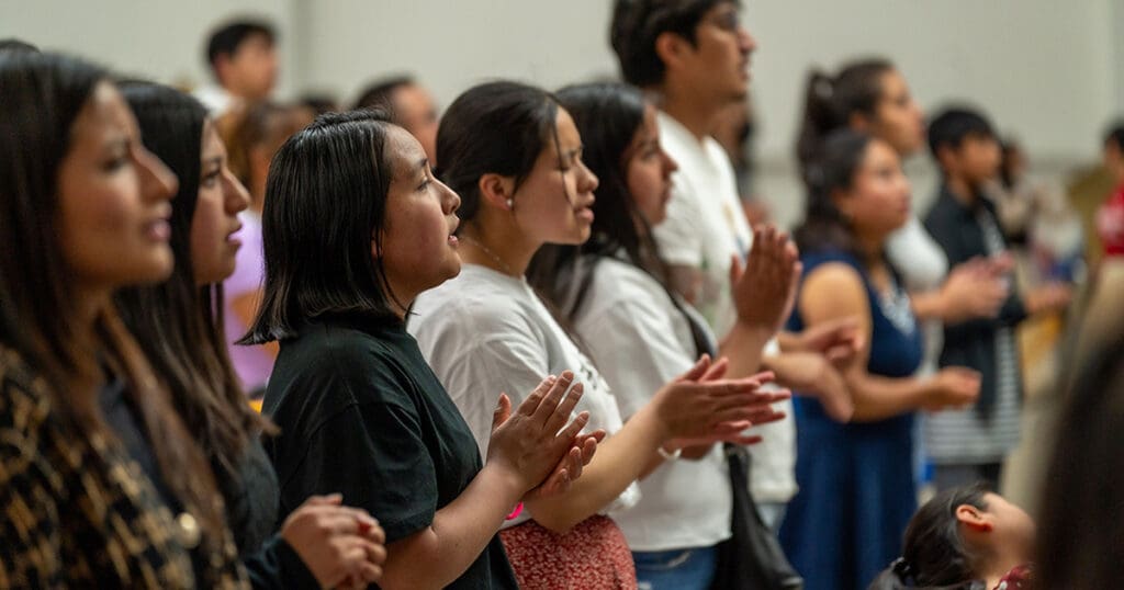 group of people worshipping in church
