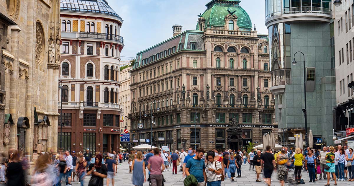 a busy street in Austria filled with people