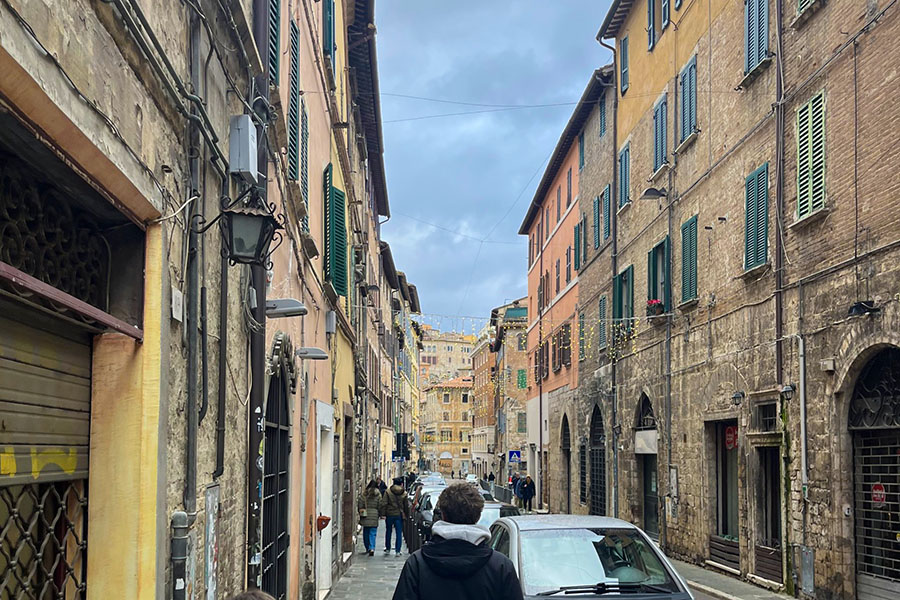 a man walking down the streets of Italy